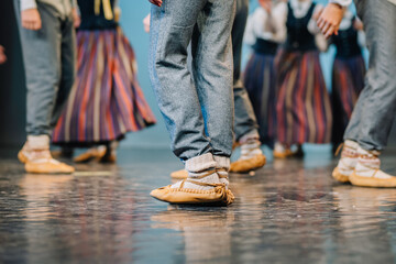 Close-up of dancers’ feet in traditional Latvian Folk dance shoes and costumes during a...