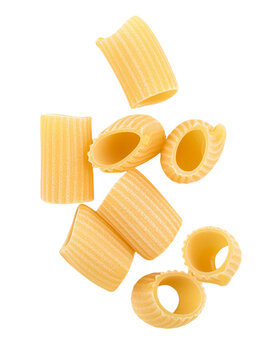 Paccheri rigati pasta falling on transparent background