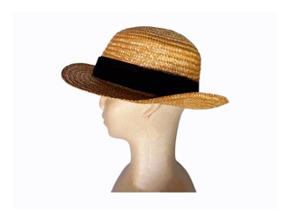 The white background in the picture is a brown hat woven from a type of dry grass that is tough and resistant to sunlight. It is detailed with beautiful patterns and has a black cloth in the middle.