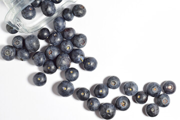 Zenith view, blueberries, with a contribution of beneficial nutrients for our body, white background.