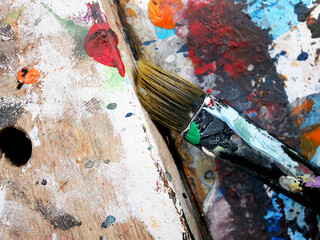 close-up detail of a painter's old used paint palette
