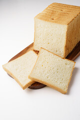 Sliced ​​toast bread on board white background isolated background