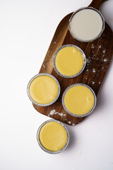 panna cotta in disposable containers. Tiramisu with different flavors