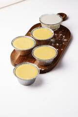 panna cotta in disposable containers. Tiramisu with different flavors