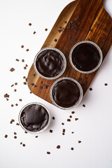 panna cotta in disposable containers. Tiramisu with different flavors