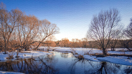 Snowy landscape with a river and trees