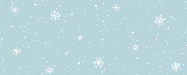 Fototapeta premium Snowflakes on light blue background. Abstract winter ice magic scene. Christmas sky landscape wallpaper or snowstorm. Cool atmosphere. Horizontal water drops for cover illustration.