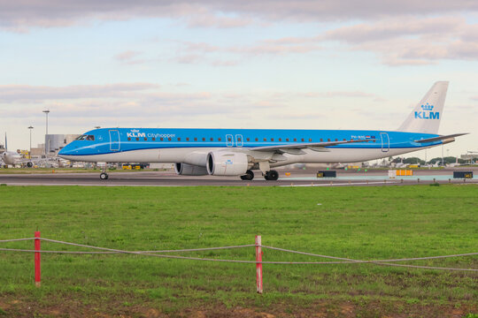 Klm cityhopper embraer 195 taxiing at lisbon airport
