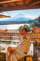 man relaxing in onsen mt fuji yukata japan
