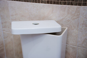 remove the lid on the toilet bowl barrel. repair of plumbing in the toilet or bathroom.