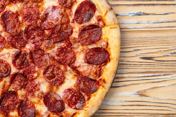 Pizza pepperoni fast food . Top view on rustic background