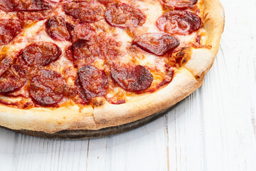 Pizza pepperoni fast food . Top view on rustic background