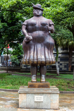 Medellin, Antioquia, Colombia : July 27 2024 : Botero Plaza. Sculpture (Mujer vestida : clothed woman) by Fernando Botero, a famous Colombian artist.