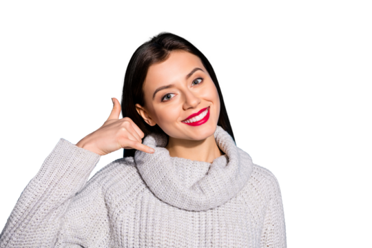 Pretty lady holding fingers near ear call me symbol wear knitted pullover isolated blue background