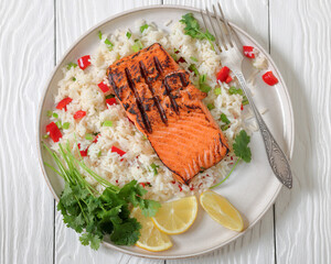 grilled red salmon fillet with rice, top view