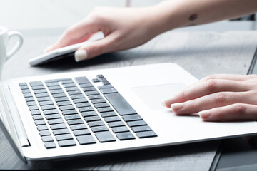 Businesswoman reaching for her mobile