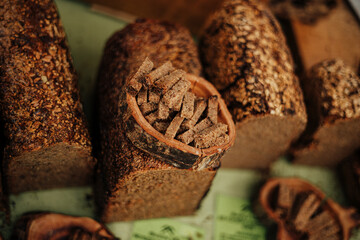 Rustic Rye Bread Slices Displayed in Wooden Bowl