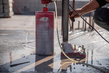 Installation of a drilling rig on a reinforced concrete floor.