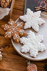 Cozy Christmas Scene with Three Different Types of Gingerbread Snowflakes