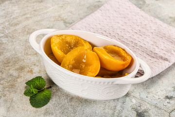 Canned marinated peach in syrop