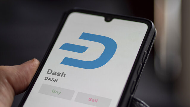 Close up on logo of (DASH) Dash crypto asset on the screen of an exchange. (DASH) Dash price stocks, $DASH on a device.