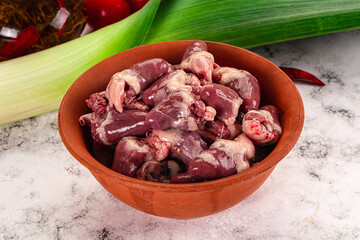 Raw chicken hearts in the bowl