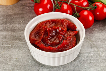 Red tomato paste in the bowl