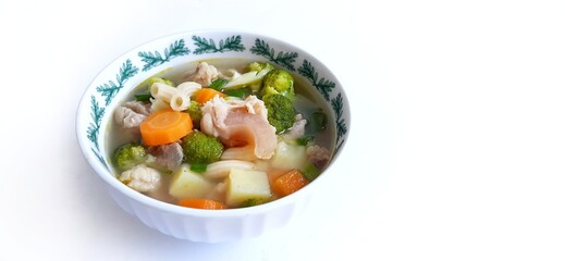 Sayur sop or vegetable with meat soup on the plate. indonesian popular culinary. Healthy food