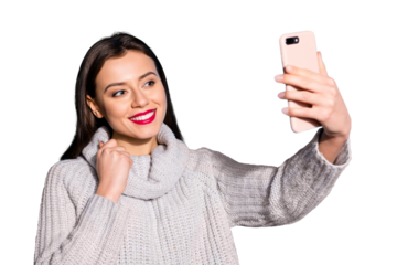 Pretty lady holding telephone hands making selfies wear warm knitted pullover isolated blue background