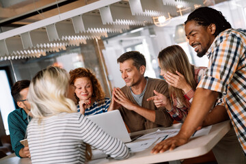 Group of successful happy multiethnic business people working as a team in office on meeting.