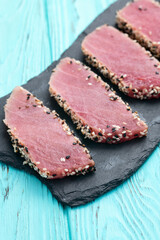 Sliced tuna steak with sesame photography . Top view
