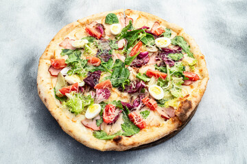 Italian pizza caesar with eggs salad chicken tomatoes and mozzarella photography. top view