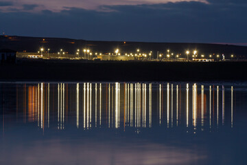 Fototapeta premium Reflection of the night light show on the water.