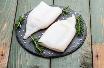 Squid tube and ring photography . Seafood top view
