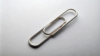 Paper clip on a background for easy editing, stationery, office supplies, metal, isolated, white, clip, attachment, organizational