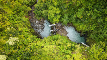 Top view to one of the many waterfalls of the Hawaiian Maui nature area close to the road to Hana