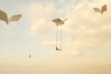 woman on a swing carried by the open pages of a. book flying in the sky