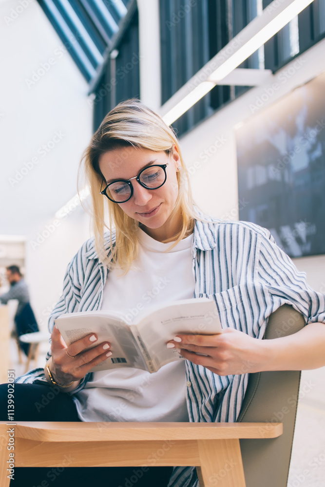 Aufkleber carefree student reading literature best seller while e learning in coworking space with high speed 