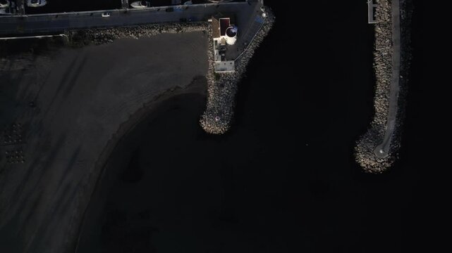 "Drone footage at sunset over La Duquesa Port in Sabinillas, M&aacute;laga. A top-down view captures docked boats, the marina layout, and the serene beauty of this Andalusian coastal harbor."