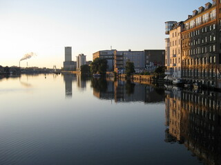 early morning in Berlin buildings reflecting in the river