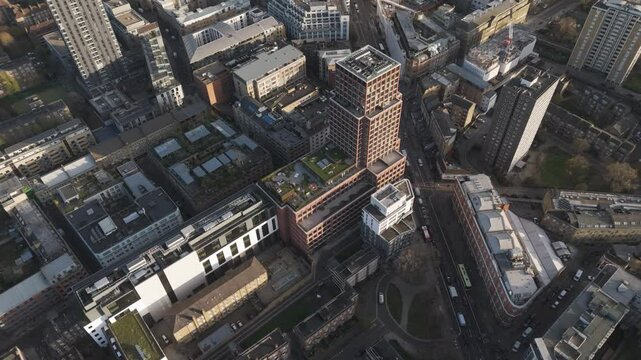 Aerial view of a modern eco-friendly apartment building with green rooftops in London, United Kingdom