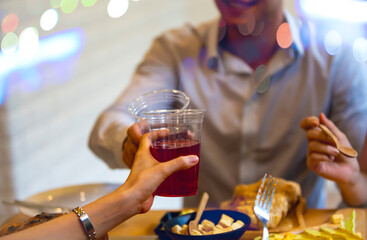 Happy moment with Cheerful Young Friends Toasting with Summer Cocktails 