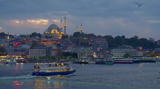 view of Istanbul skyline and ships on Bosphorus, Turkey, city architecture, popular tourist destination
