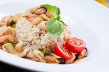 seafood rice on the white plate