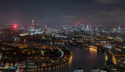 Stunning aerial view of London cityscape featuring Thames River and iconic landmarks captured at various times of day and night