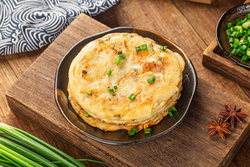 Green onion pancakes are a fried Chinese flatbread often eaten as a snack or with a meal.