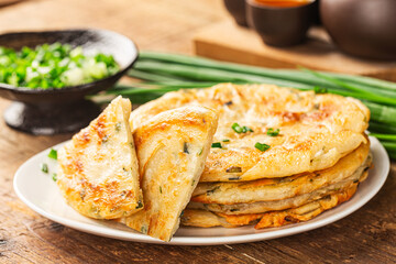 Green onion pancakes are a fried Chinese flatbread often eaten as a snack or with a meal.