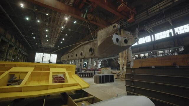 An interior view showcasing an aircraft manufacturing facility with modern technology and equipment. Stock Clip