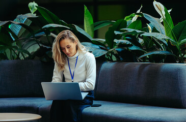 Young female professional working in a sustainable office space