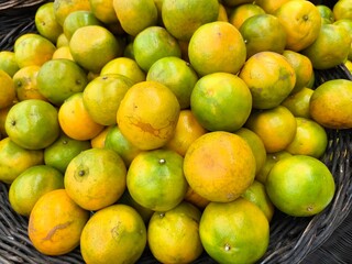 Fresh orange background. Tangerine in supermarket